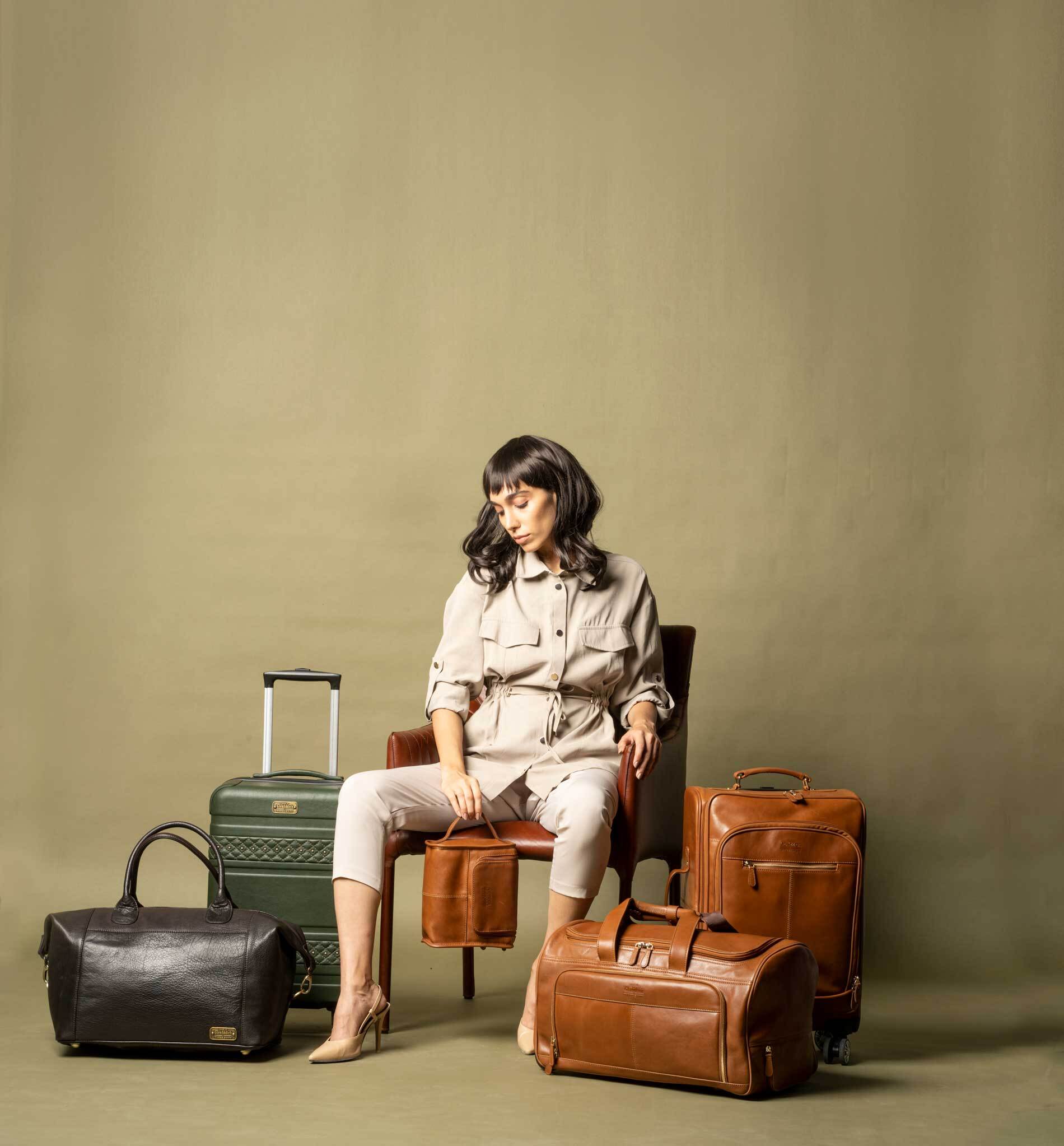 person sitting with luggage